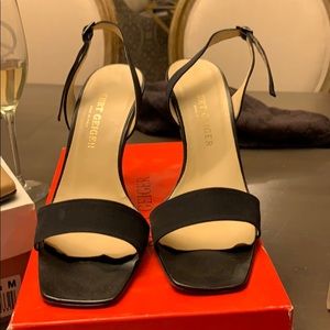 Black satin pumps